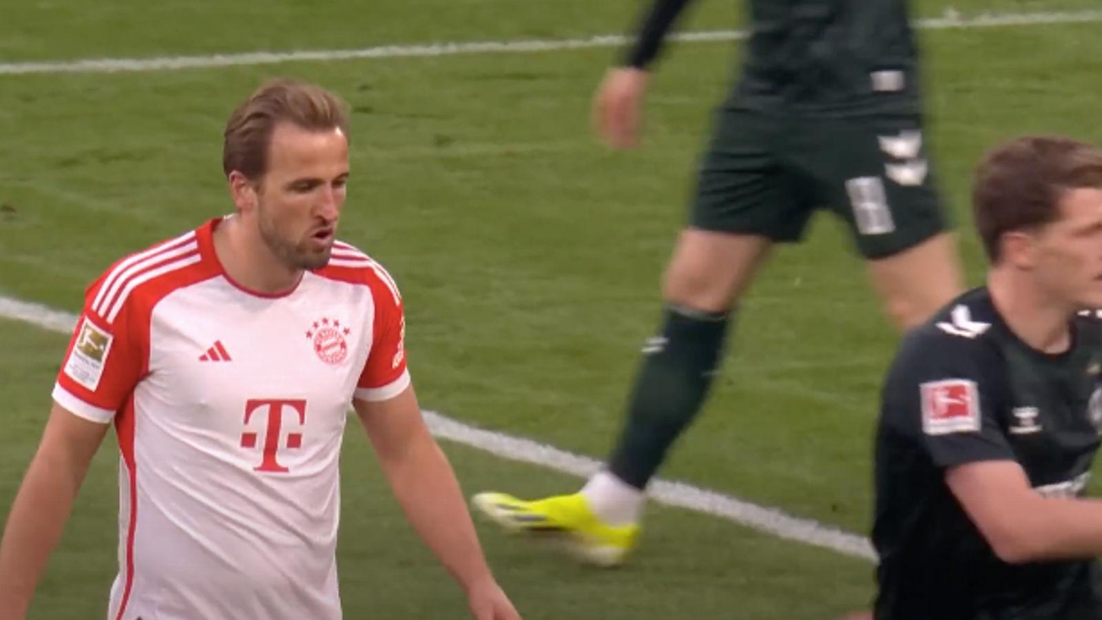 Bayern Munich striker Harry Kane looks disappointed.