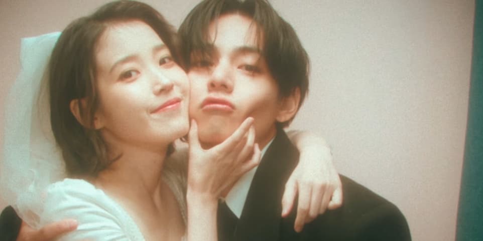 BTS' V and IU pose like a wedding couple in a photo booth