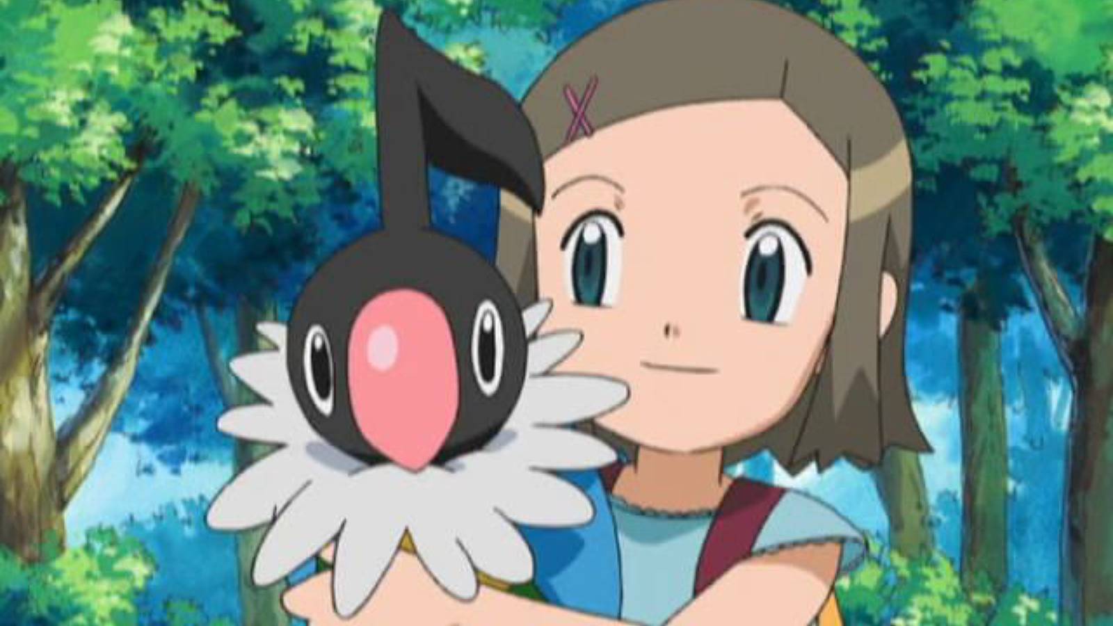 A screenshot from the Pokemon anime shows a young girl holding a Chatot