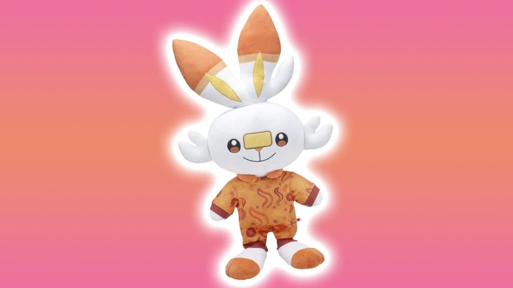 scorbunny plush from build-a-bear with a white glow and on a pink/orange background