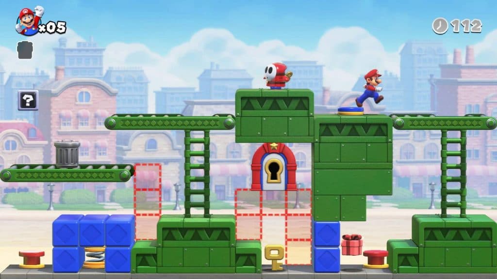 Mario makes his way through a colorful level filled with wind-up Shy Guys