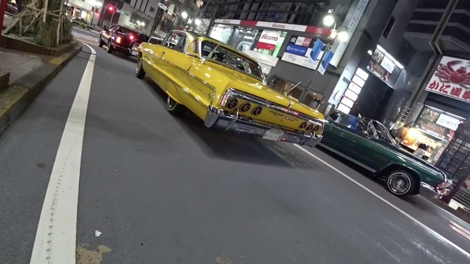Yellow Chevrolet Impala in Tokyo street