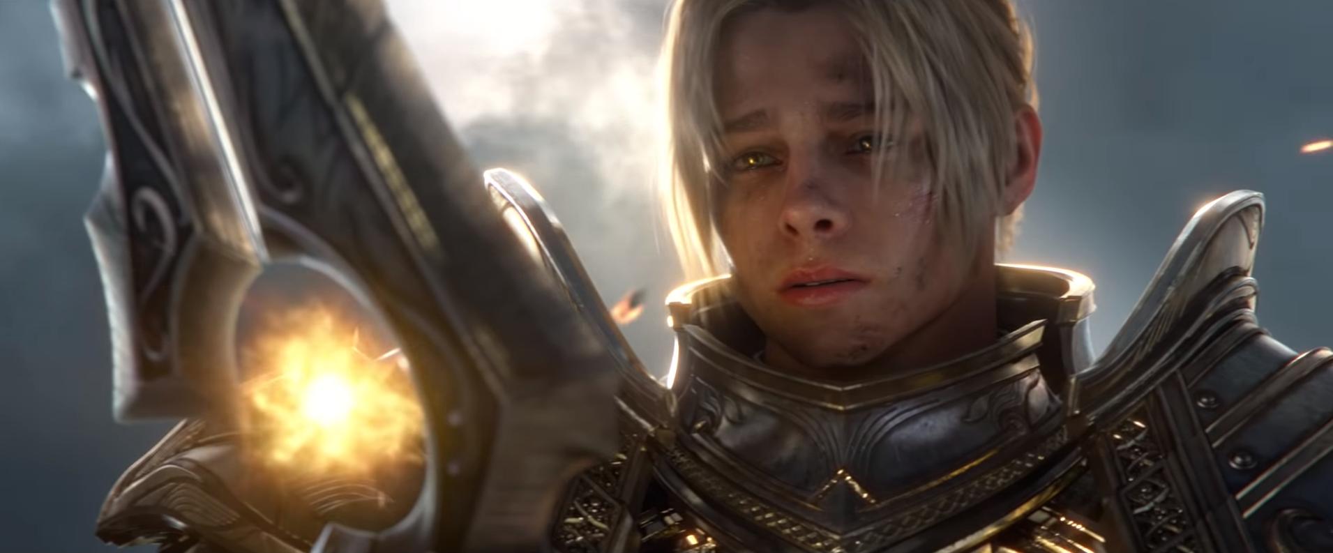 Anduin Wrynn looks at his glowing World of Warcraft sword.