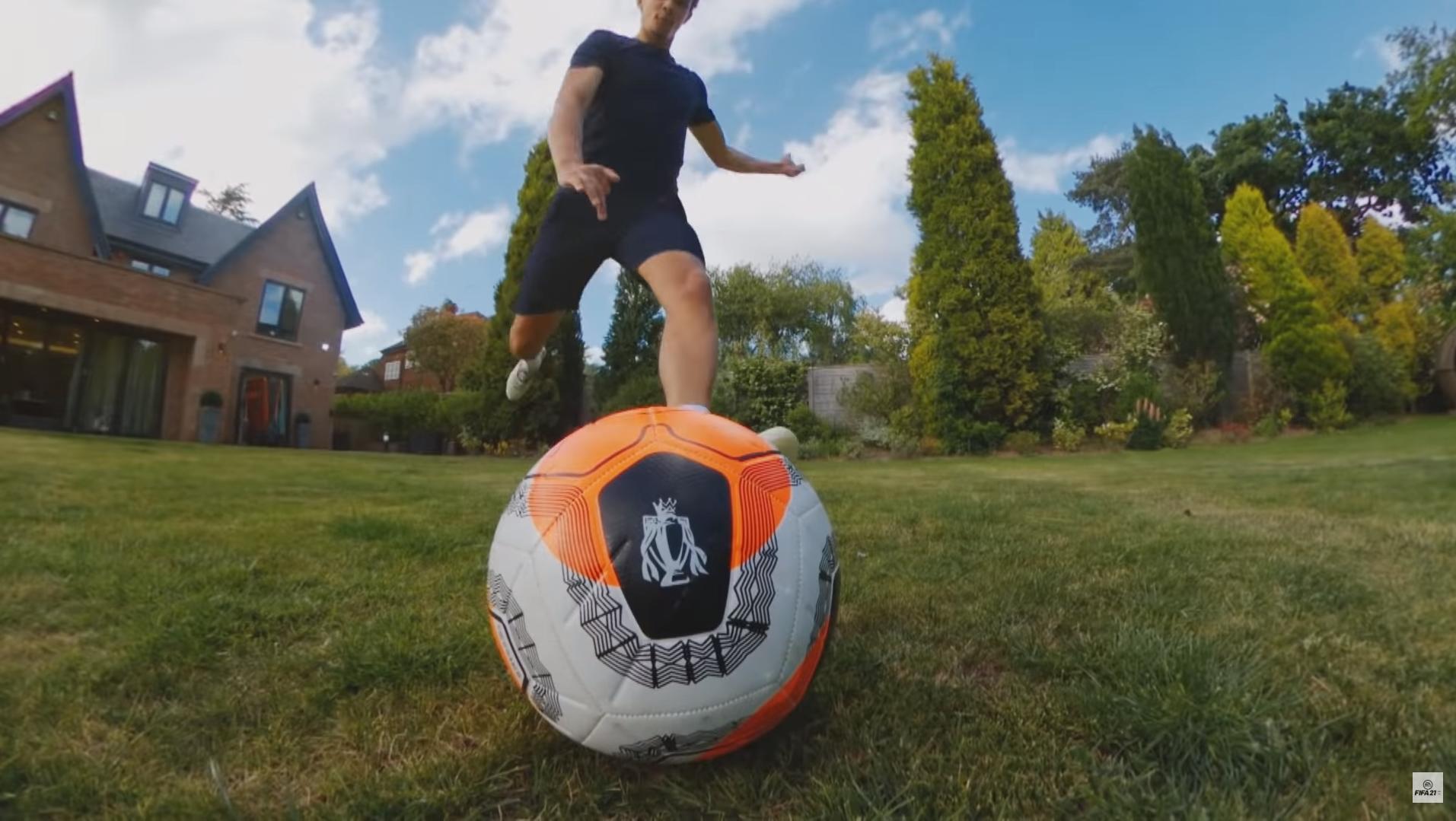 Trent Alexander-Arnold kicks a ball in the FIFA 21 reveal trailer.