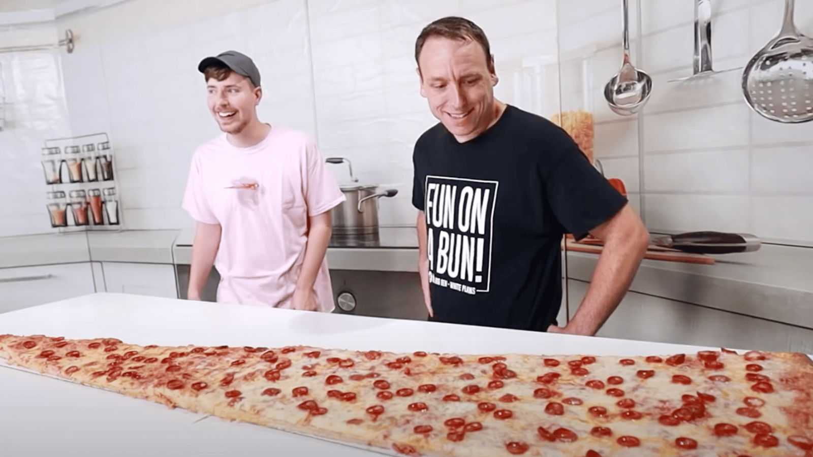Joey Chestnut and Mr Beast, world's largest pizza slice