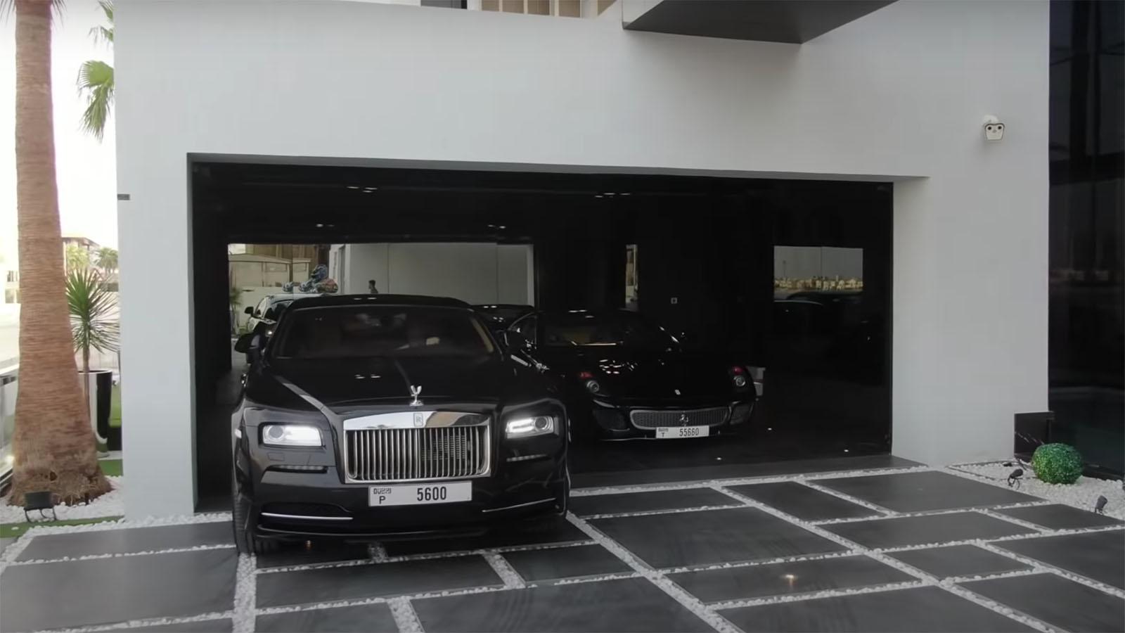 Rolls Royce and Ferrari in mansion garage