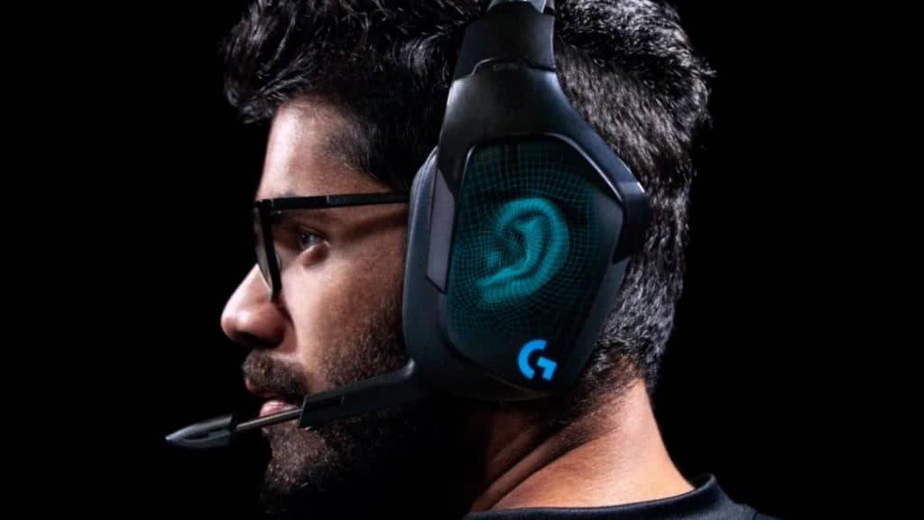 Image of a person wearing the Logitech G935 wireless gaming headset with a black background.