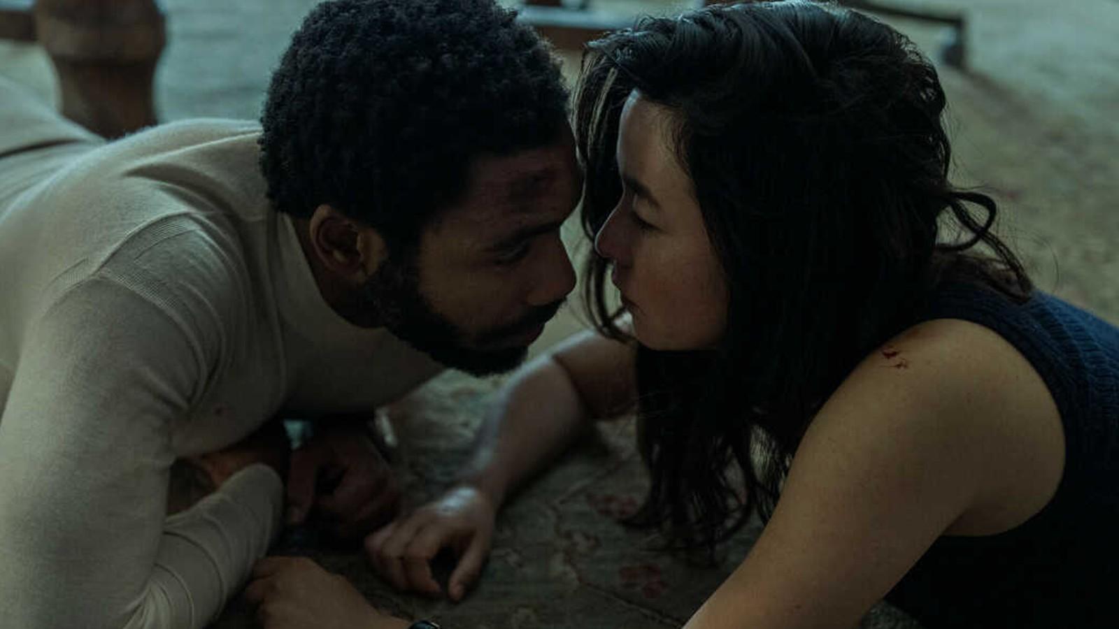 Donald Glover and Maya Erskine getting hot and heavy in Mr. and Mrs. Smith.