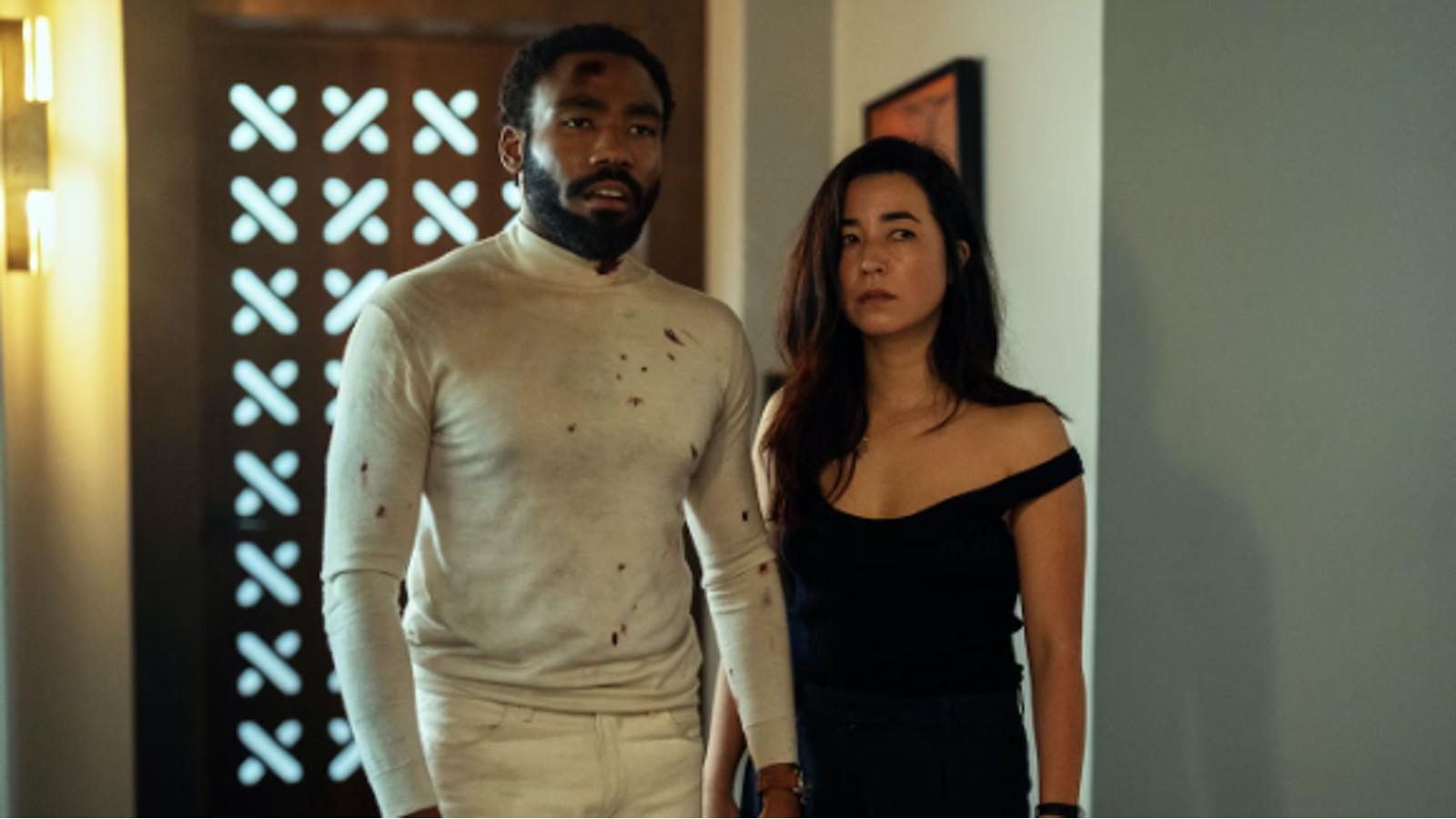 Donald Glover and Maya Erskine battered and bloodied in Mr. and Mrs. Smith