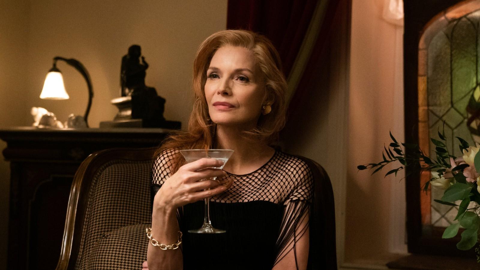 Michelle Pfeiffer drinking wine in French Exit.