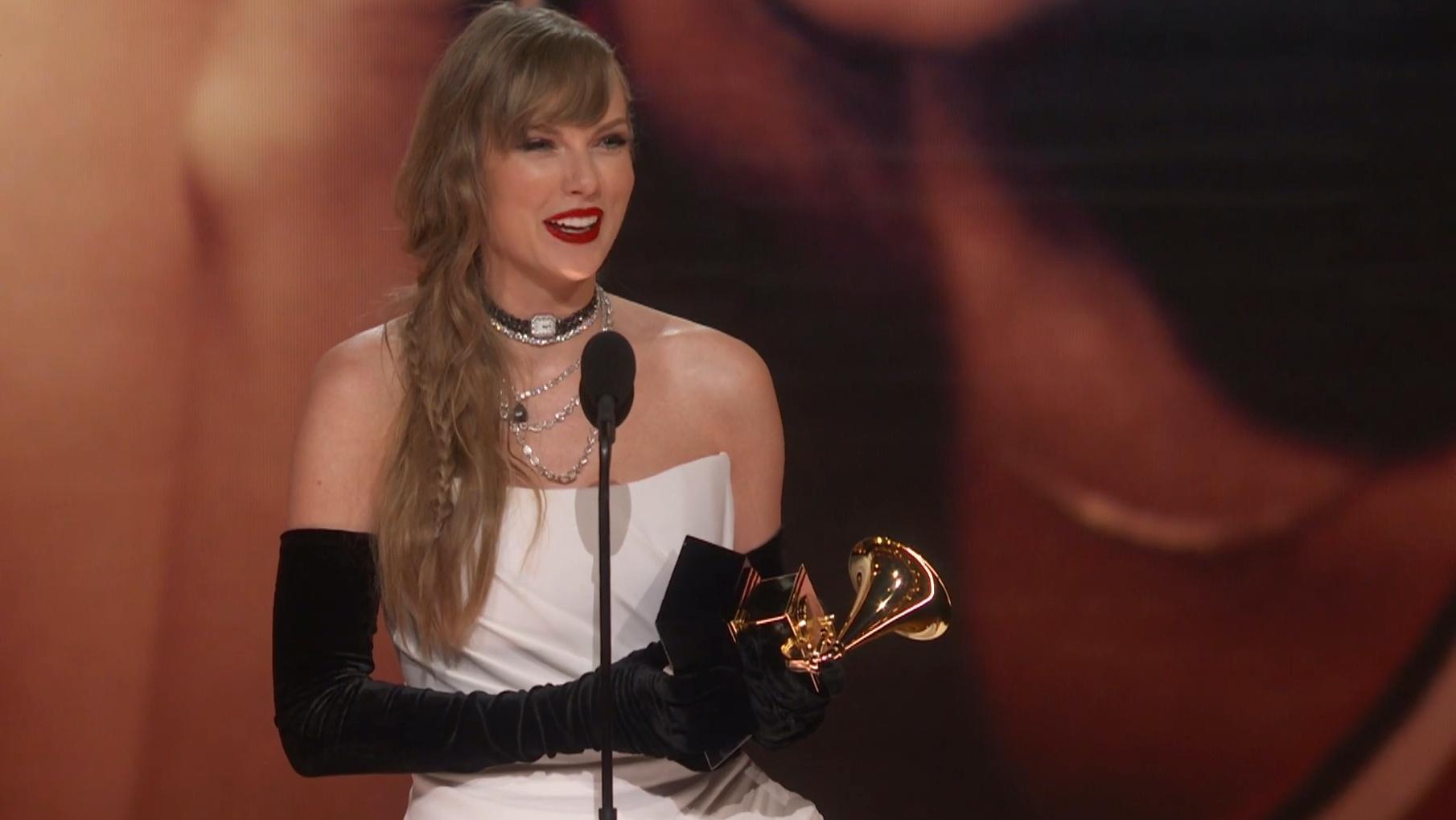 Taylor Swift accepting an award at the 2024 Grammy Awards