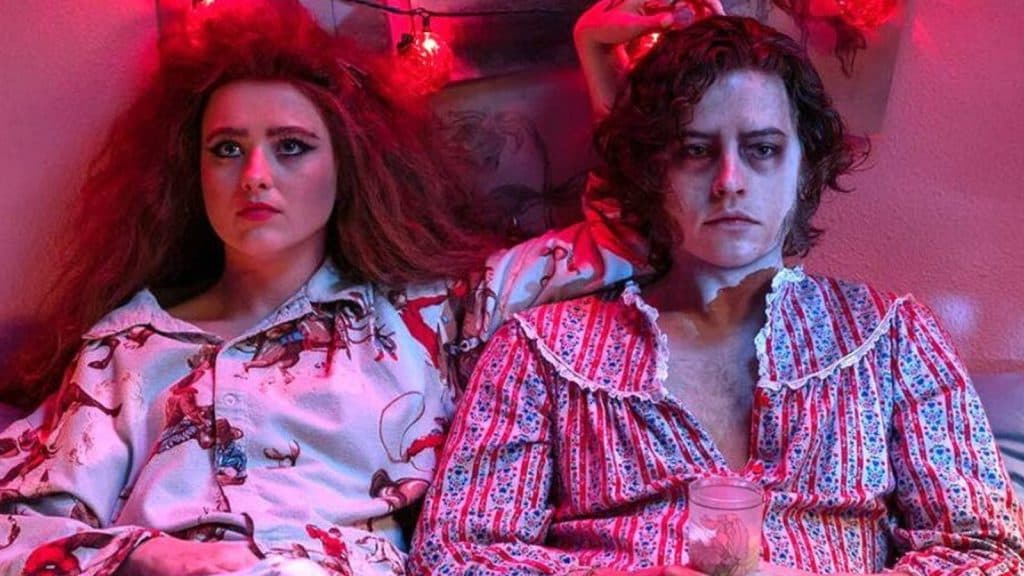 Kathryn Newton and Cole Sprouse in bed in Lisa Frankenstein.