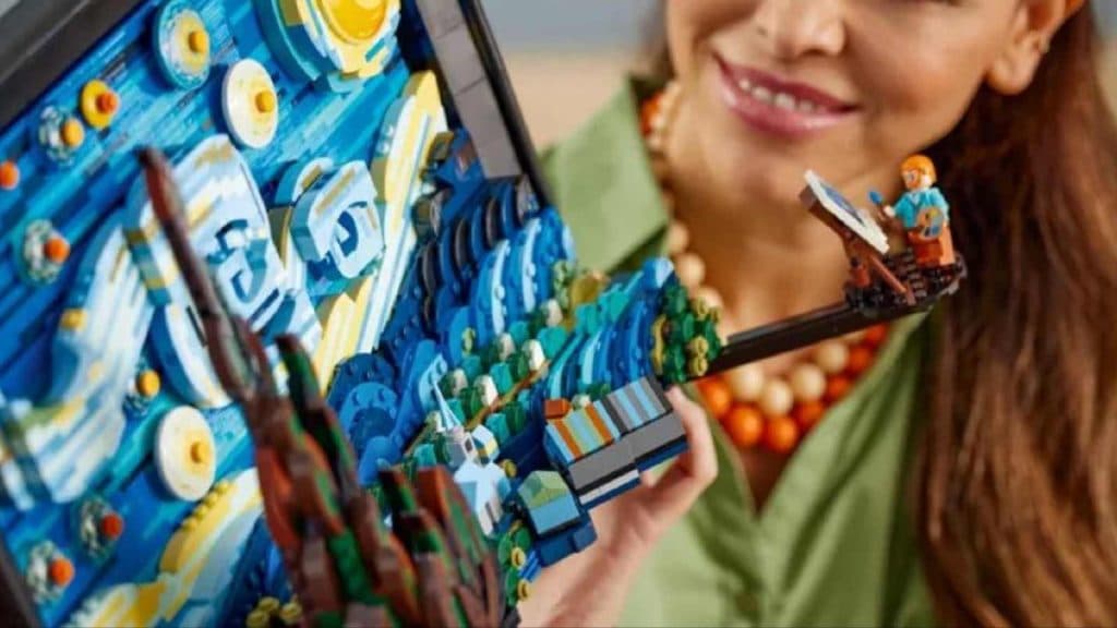 An adult admiring their LEGO Ideas Vincent van Gogh The Starry Night set