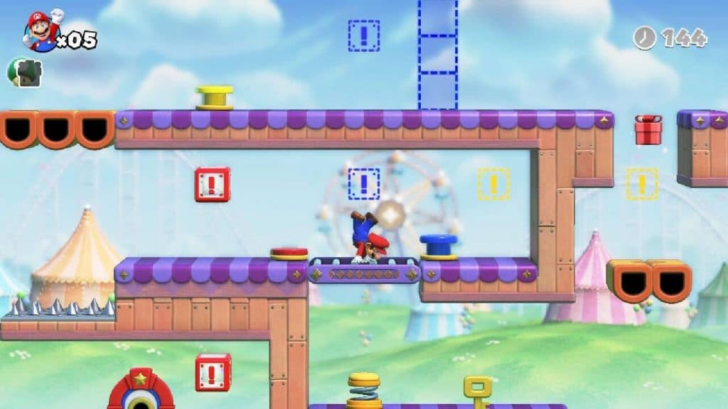 Mario walks on his hands through a circus-themed level