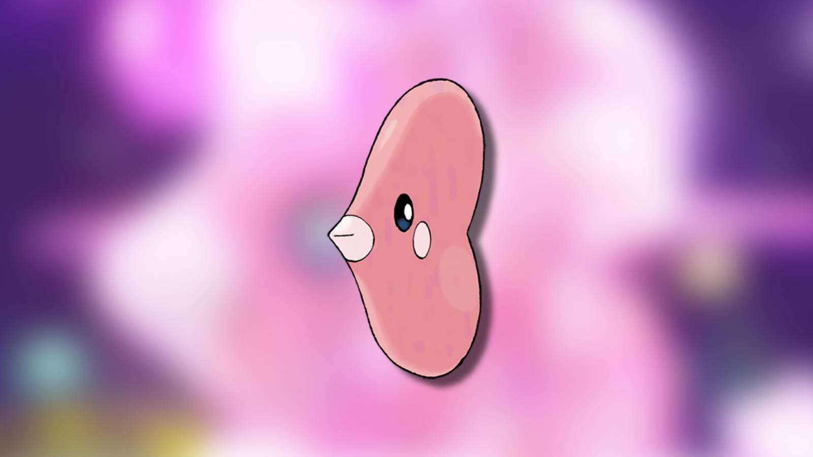 The Pokemon Luvdisc appears against a blurred background