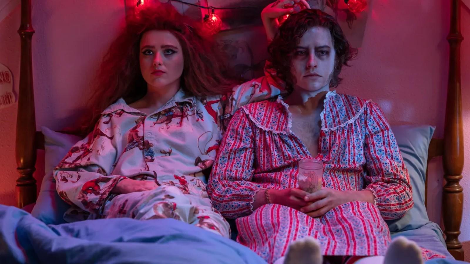 Kathryn Newton and Cole Sprouse lying in bed in Lisa Frankenstein.