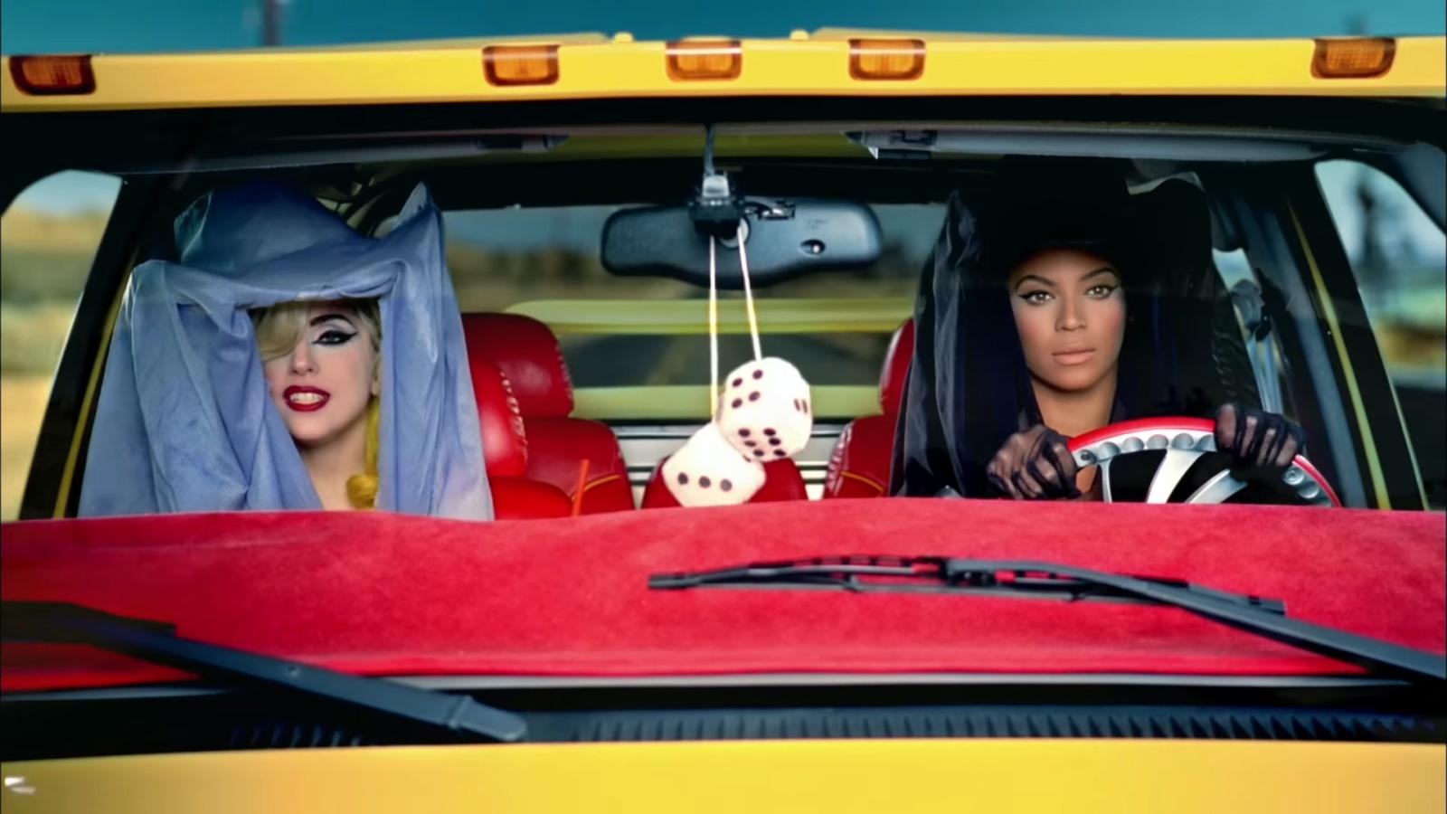 Beyoncé and Lady Gaga sitting in the front seat of a pickup truck