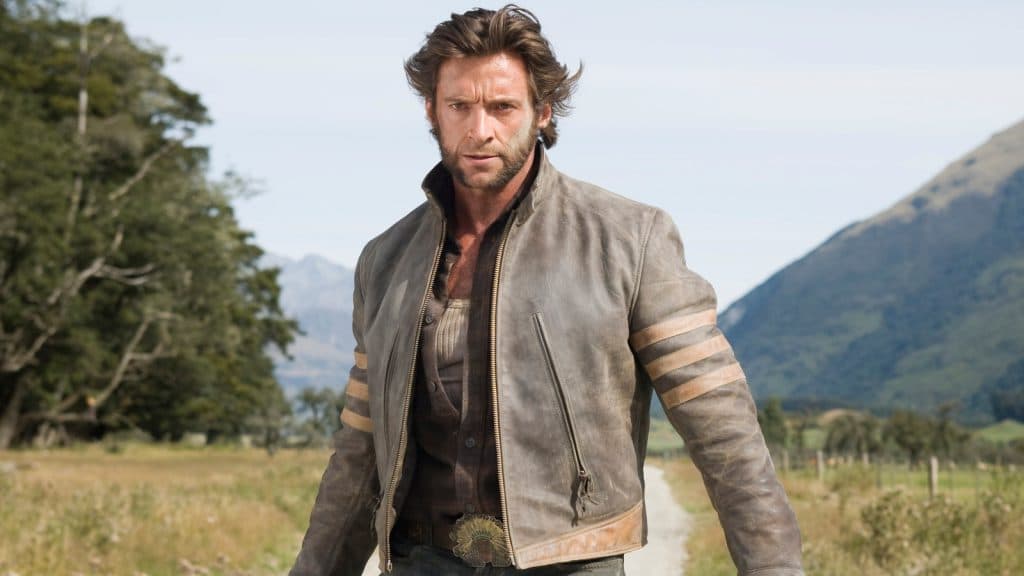 Hugh Jackman as Logan stands on a country road in the film X-Men origins: Wolverine.