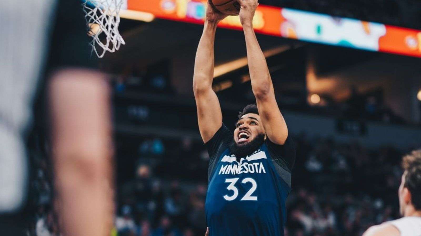 Karl-Anthony going up for a slam dunk as a member of the Minnesota Timberwolves.