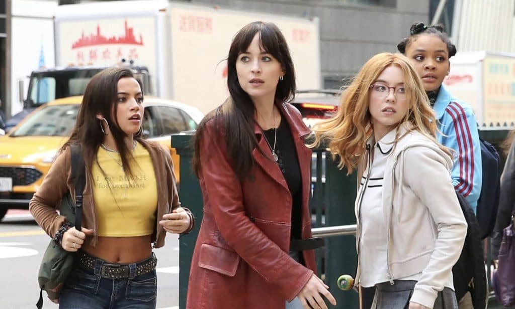The cast of Madame Web in New York City, looking panicked in the street