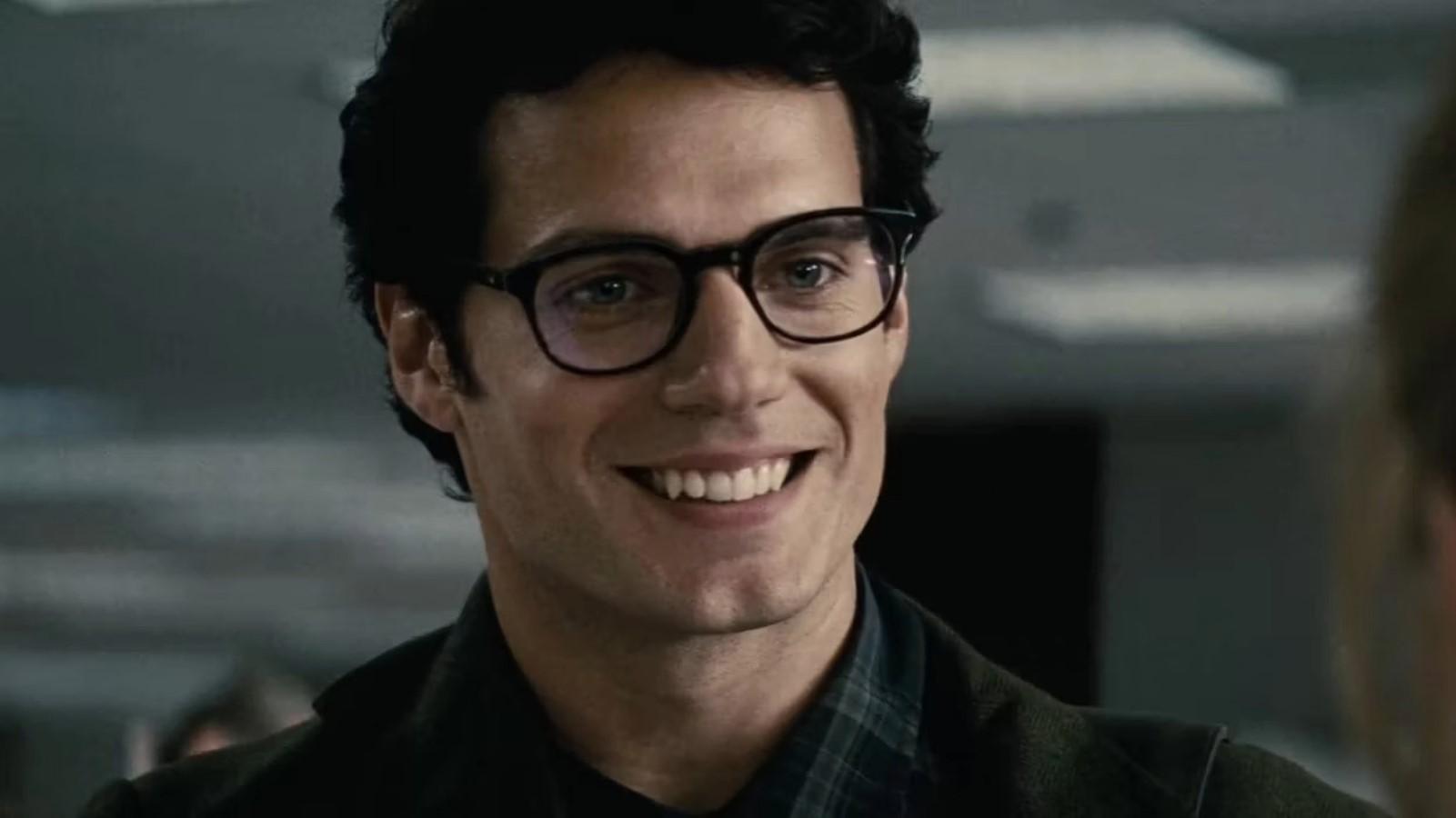 Henry Cavill as Superman, smiling and wearing glasses