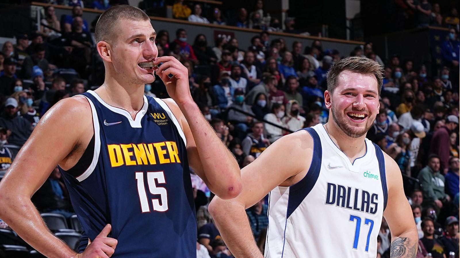 Nikola Jokic (left) and Luka Doncic (right share the floor during free throws.