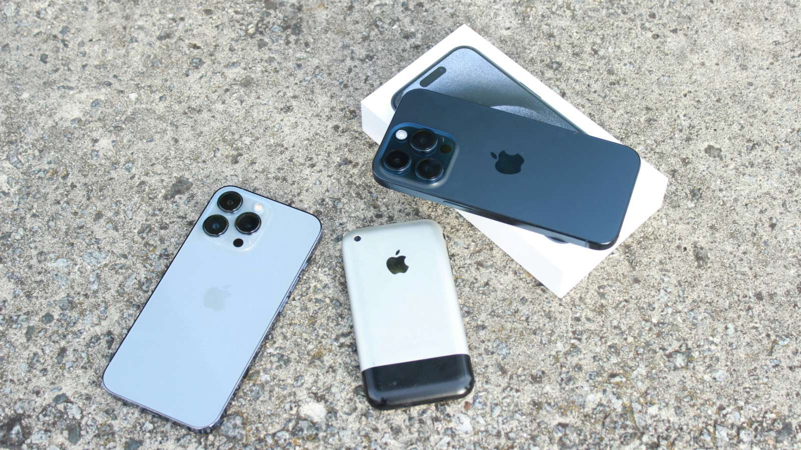 Image showing three iPhones from different generations next to each other
