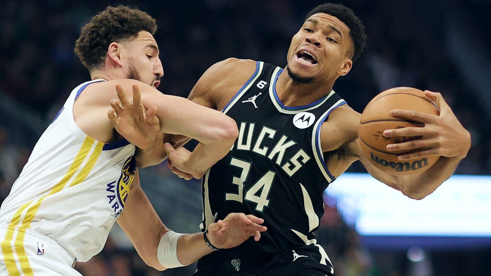Giannis Antetokounmpo defended by Klay Thompson in regular season action.