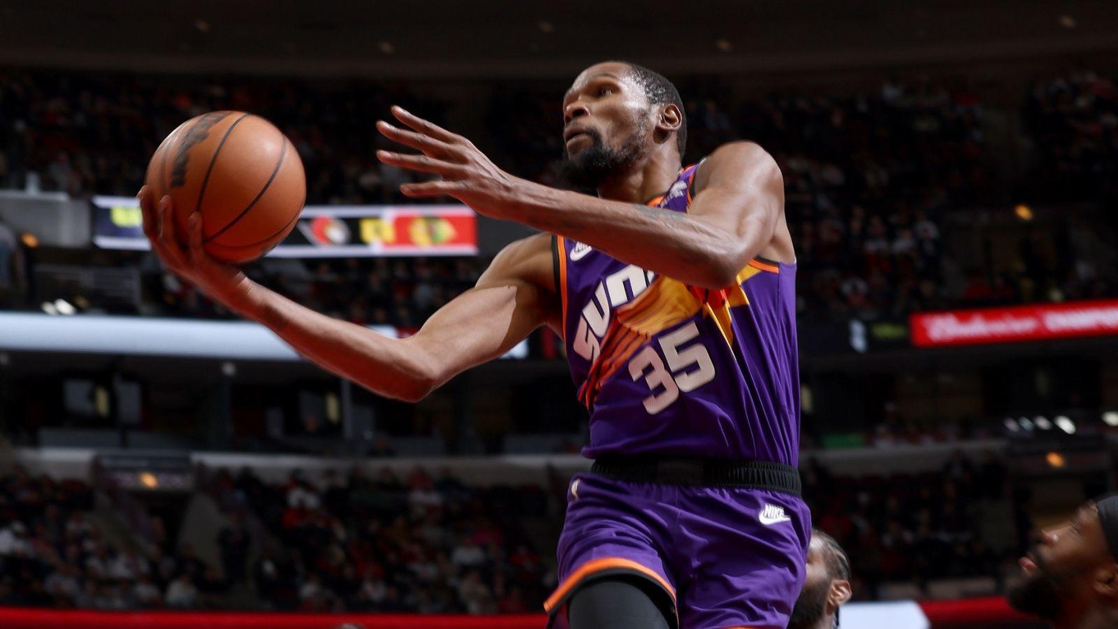Kevin Durant attempts a field goal as a member of the Phoenix Suns.