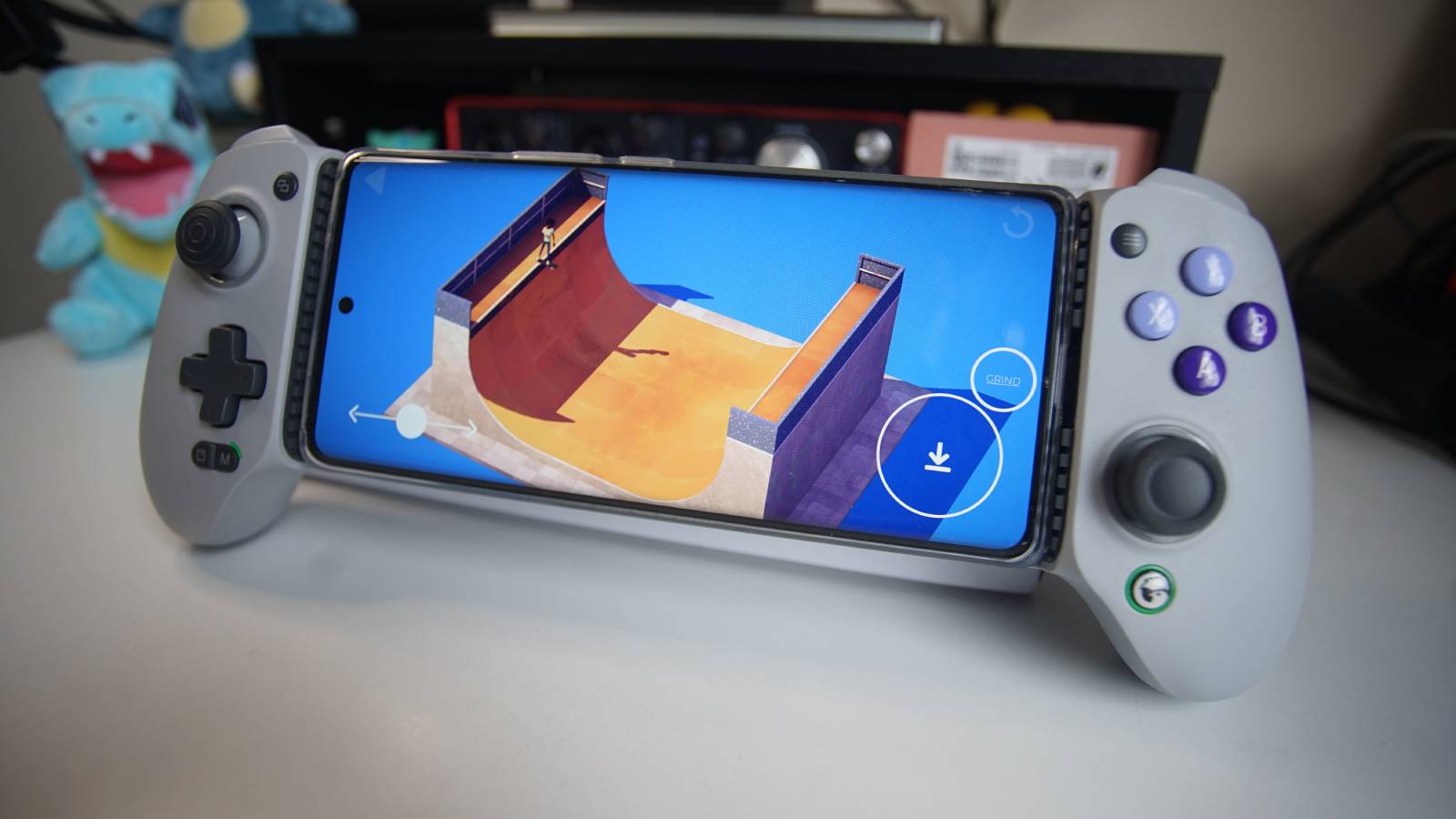The GameSir G8 Galileo mobile controller is propped up, with a phone fixed into the device playing The Ramp