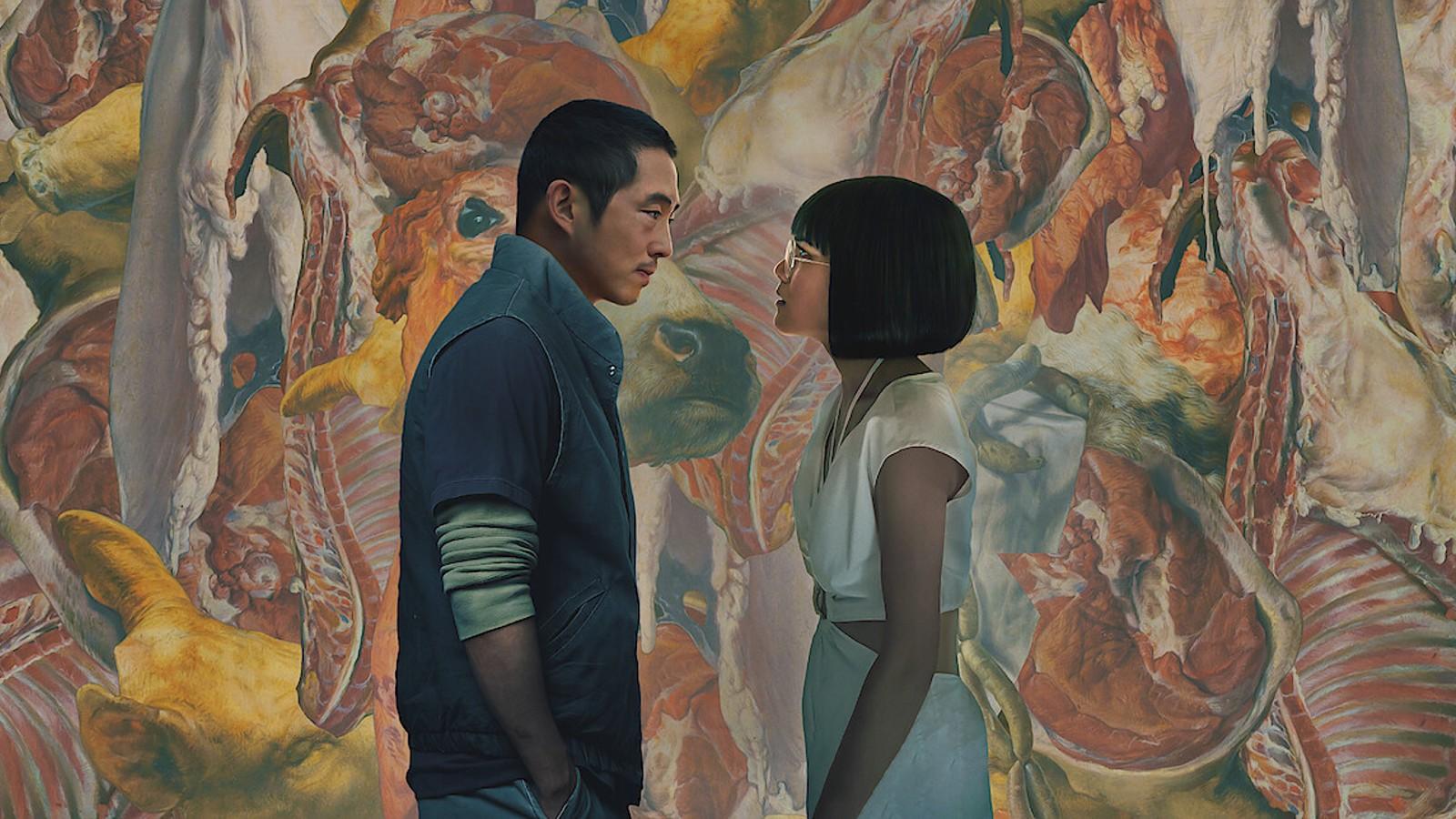 Steven Yuen and Abi Wong face-to-face in a gallery in Beef.