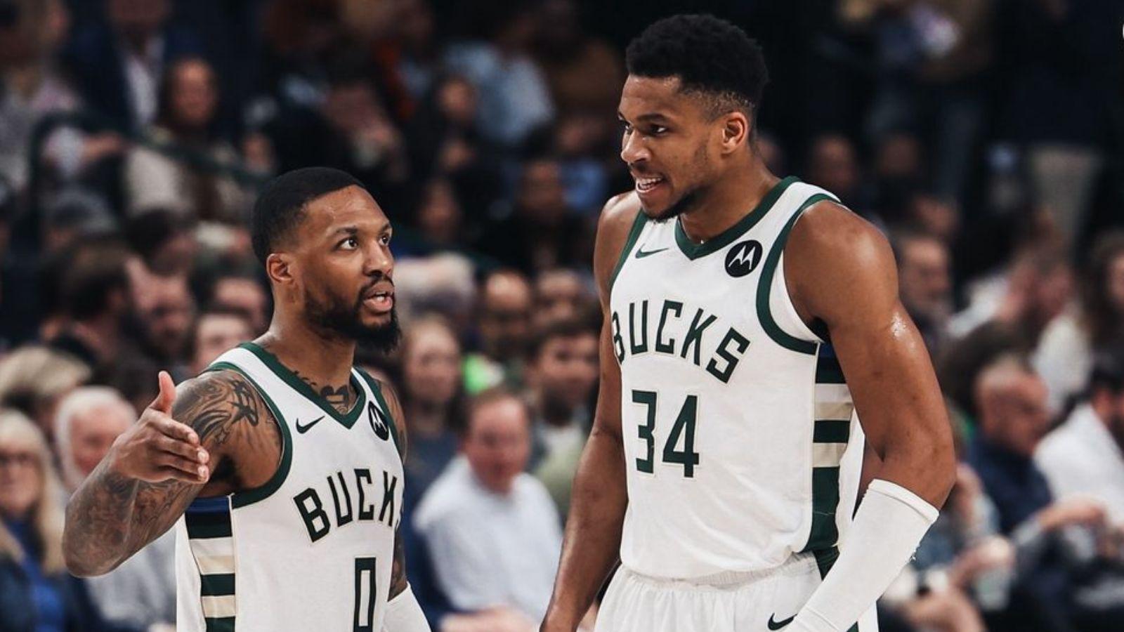 Damian Lillard (left) and Giannis Antetokounmpo (right) communicating on the floor.