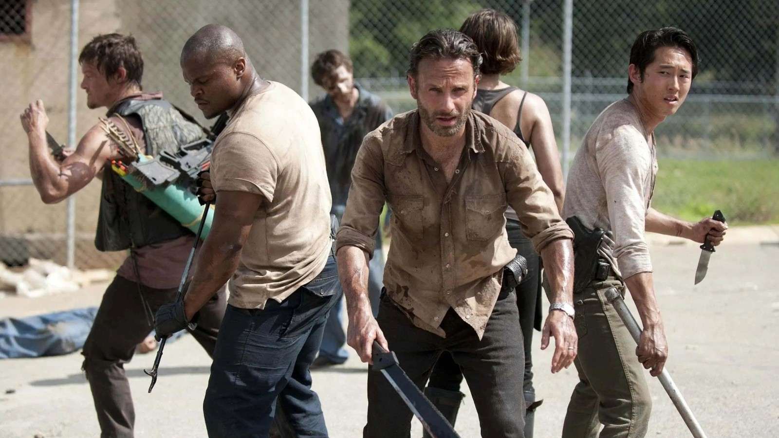 The Walking Dead: Rick stands with his group in a prison yard, in fighting stance
