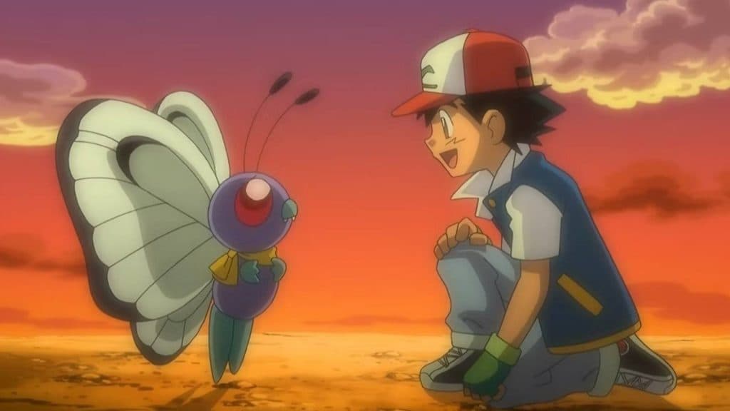 Ash Ketchum kneels down next to his Butterfree