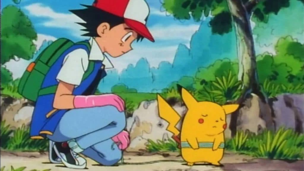 Ash Ketchum wears rubber gloves while attempting to tame Pikachu