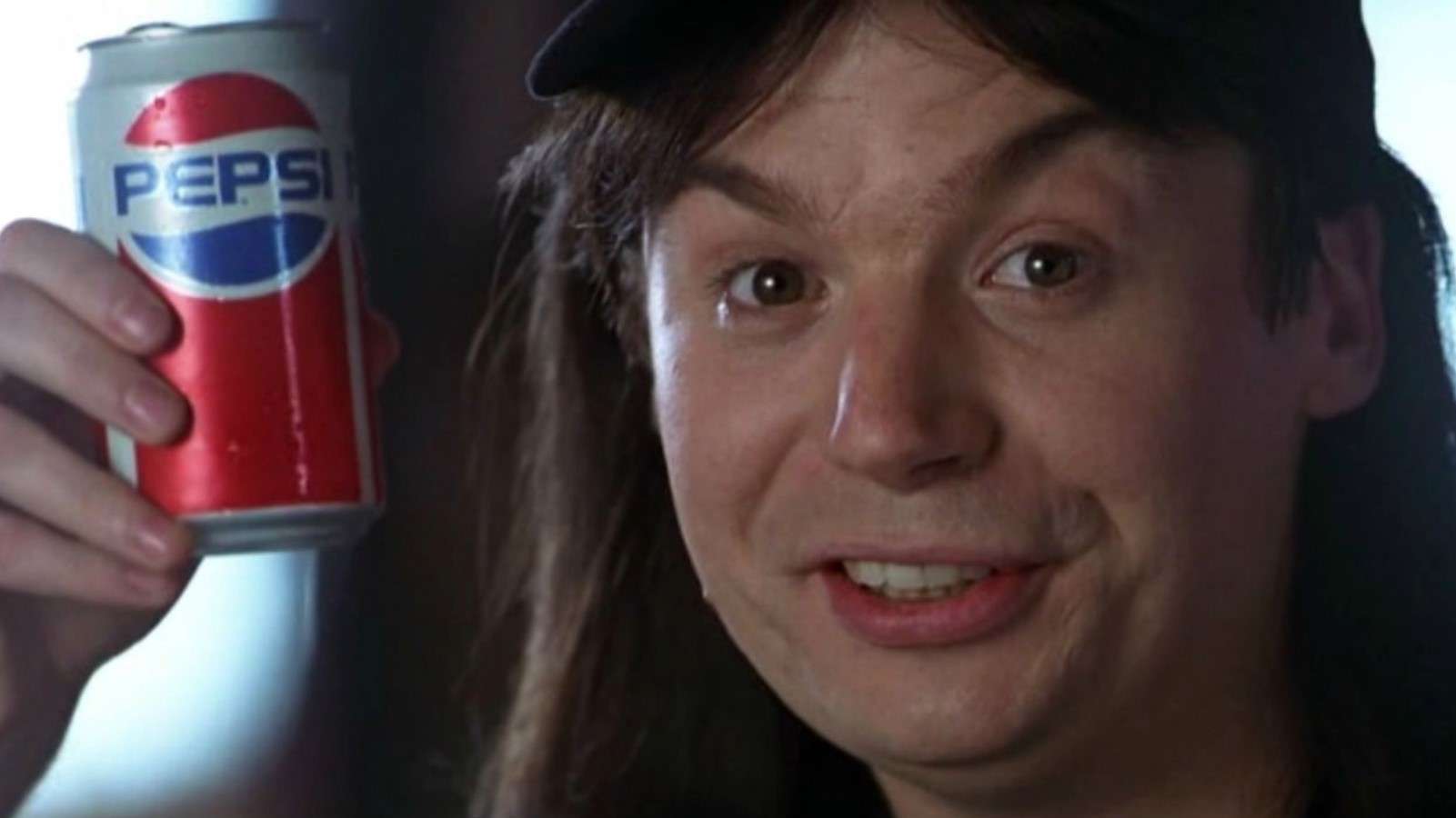 Mike Myers in Wayne's World holding up a can of Pepsi