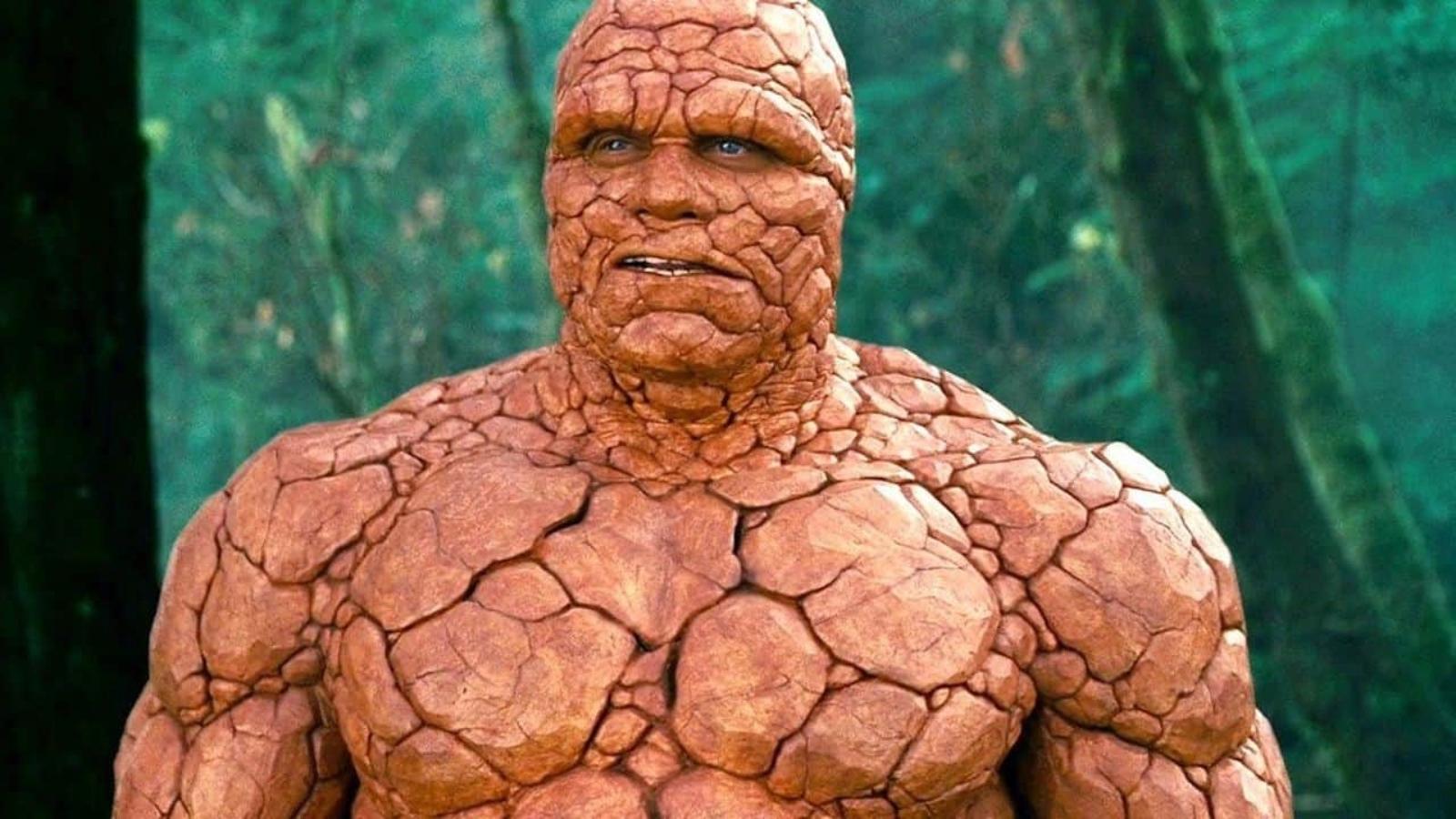 The Thing in The Fantastic Four standing in the woods with trees in the background