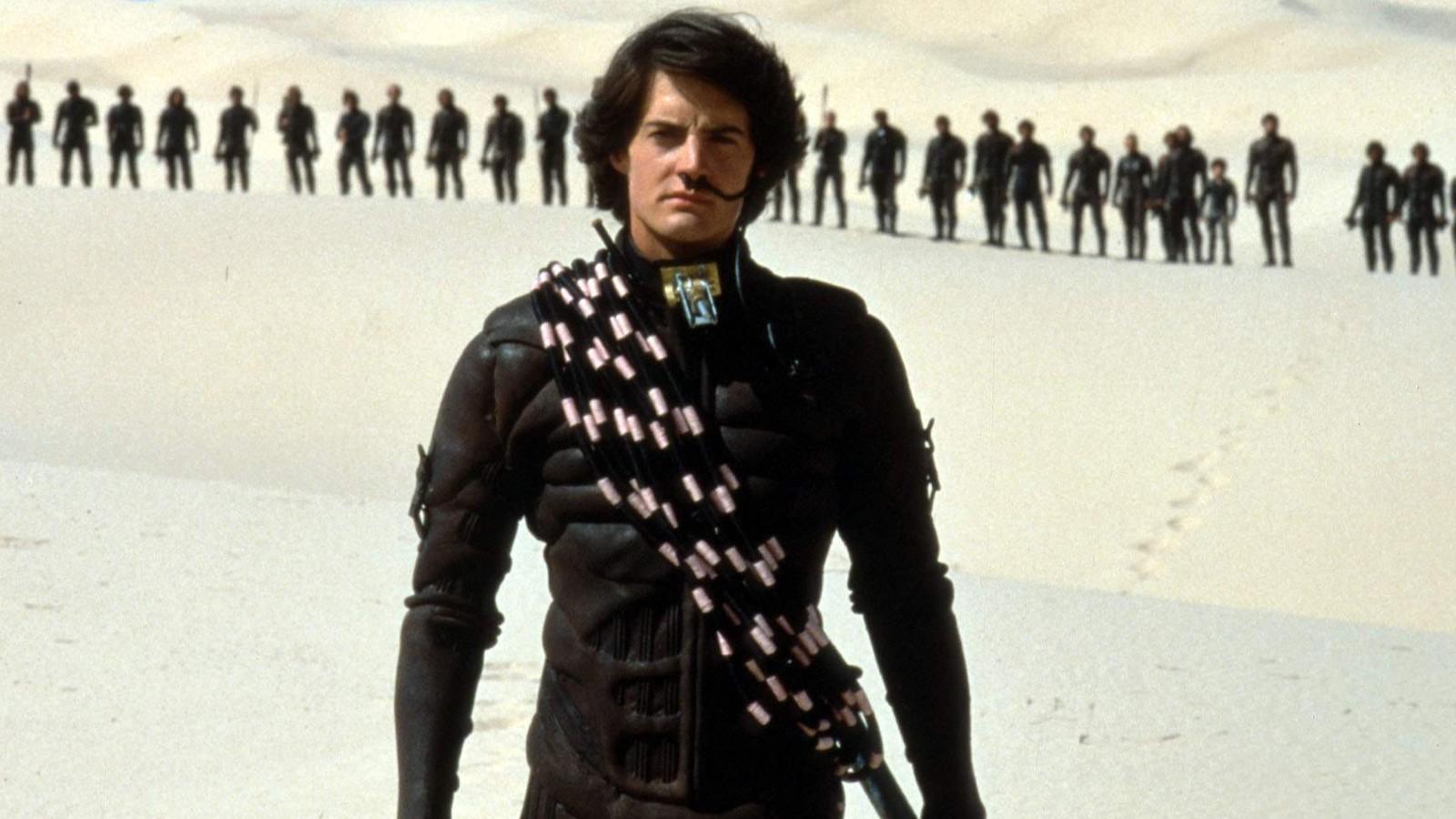 Kyle McLachlan standing in the sands of Dune.