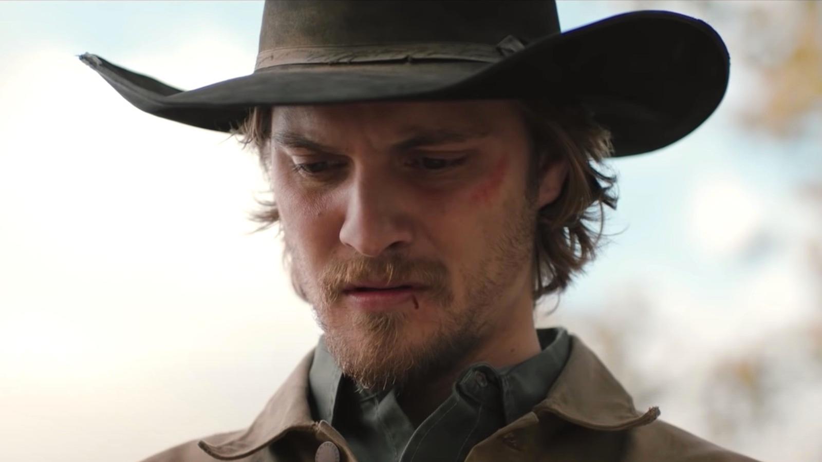 Luke Grimes as Kayce Dutton in Yellowstone, staring at the ground and looking sad