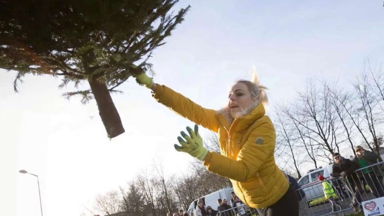 woman Christmas tree throwing contest