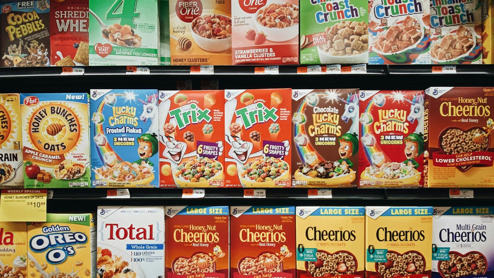 Boxes of cereal on the shelf at a grocery store