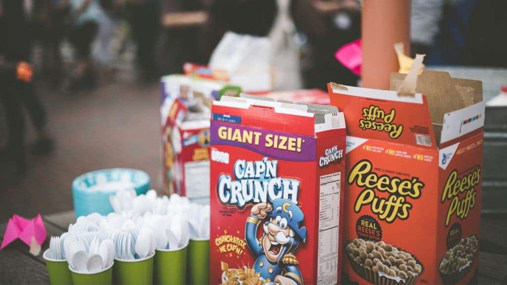 open oxes of Cap'n Crunch and Reese's Puffs cereal