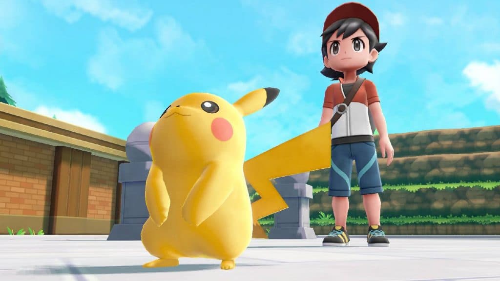 Pikachu and a Pokemon trainer stand ready for battle