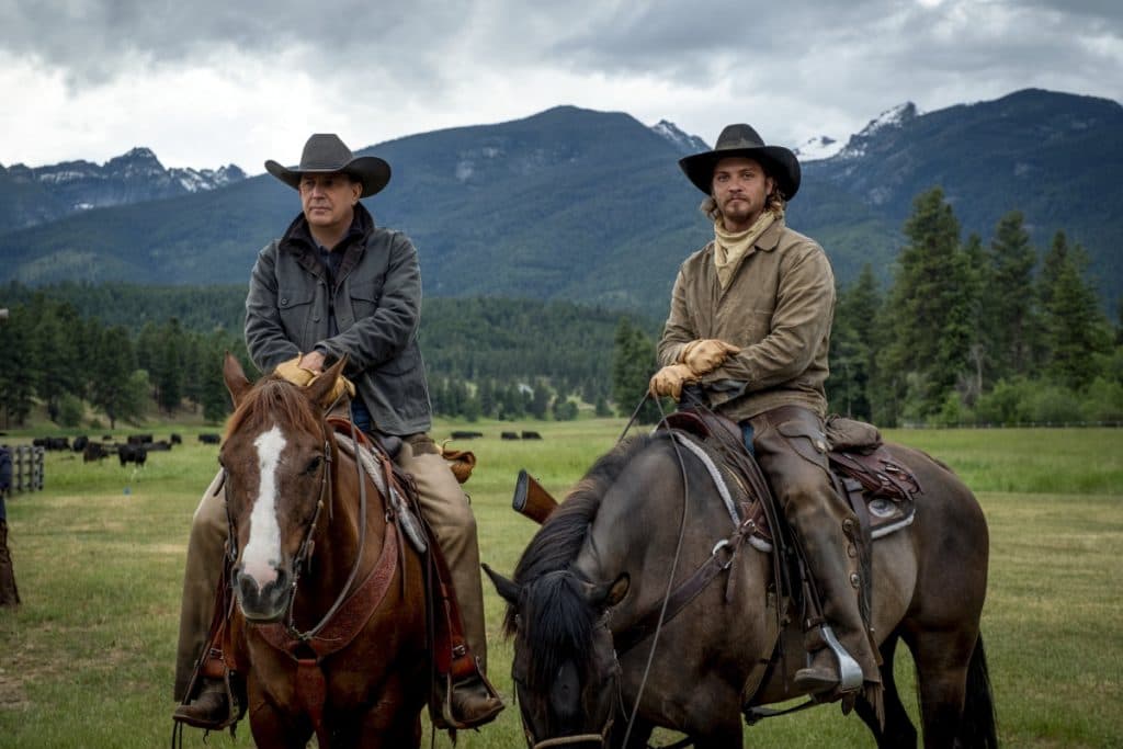 Kevin Costner and Luke Grimes as John and Kayce Dutton in Yellowstone, riding horses