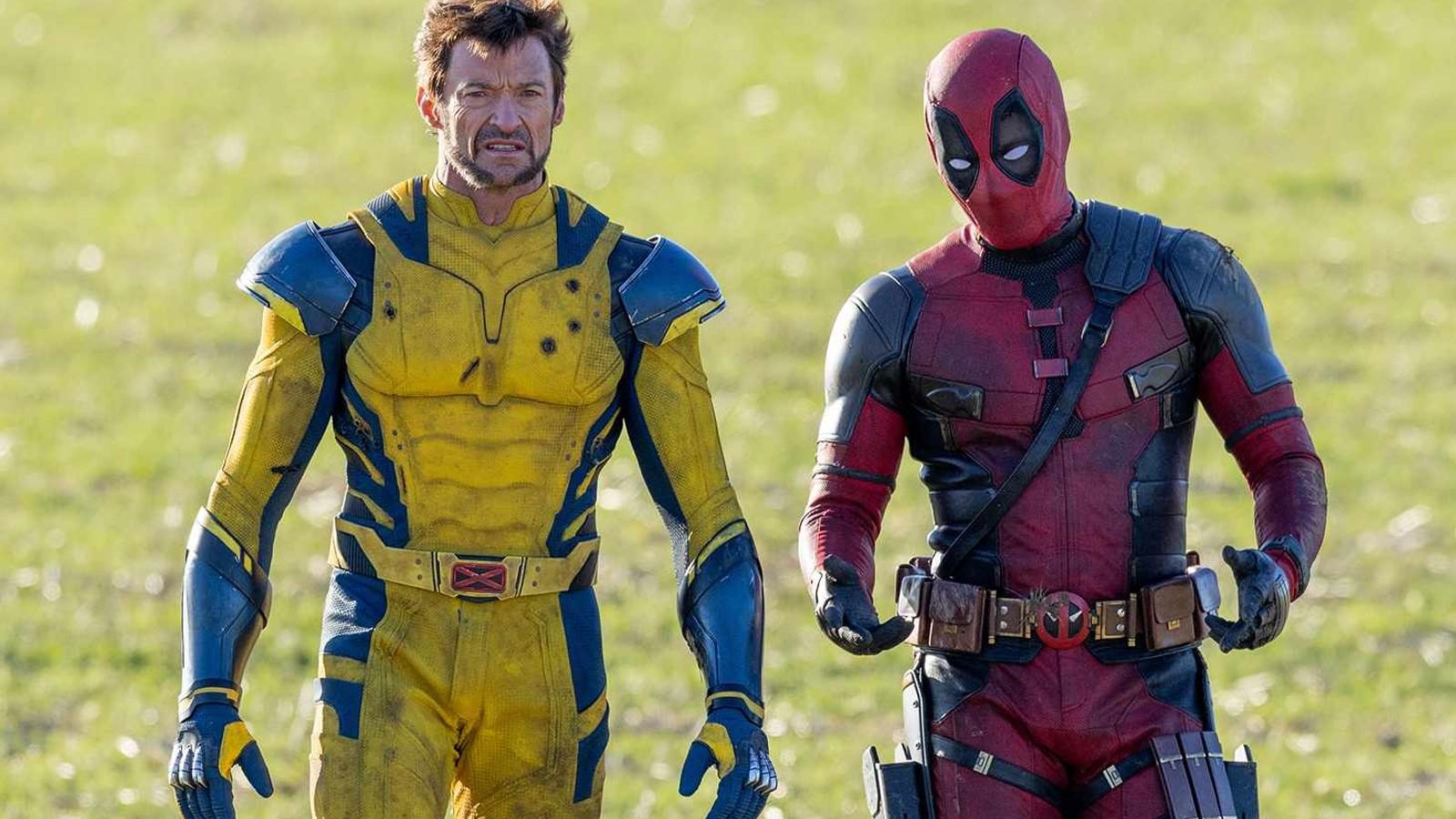 Deadpool & Wolverine chatting in a field.