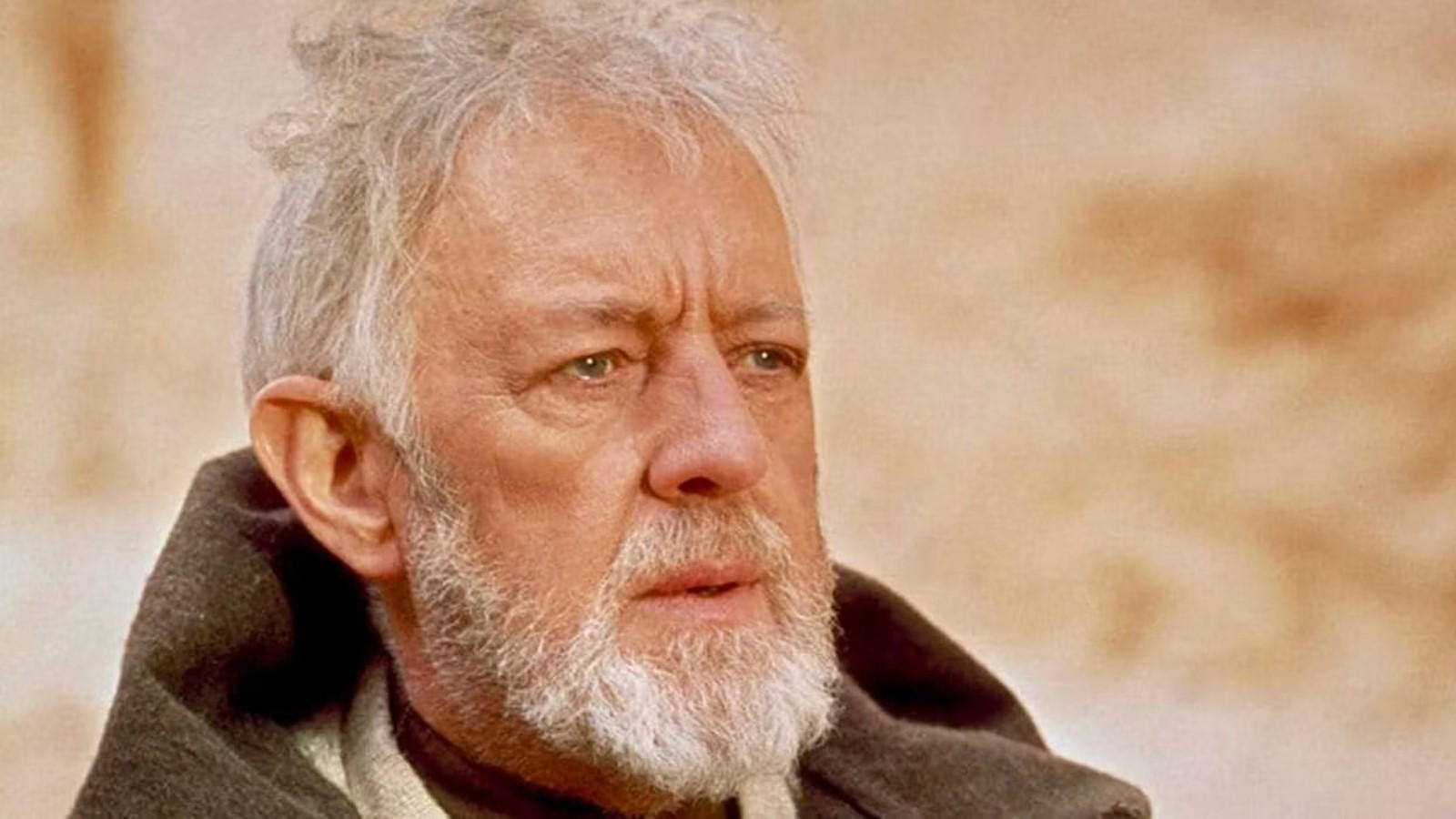 Alec Guinness as Obi-Wan in Star Wars, standing in the desert and wearing a robe