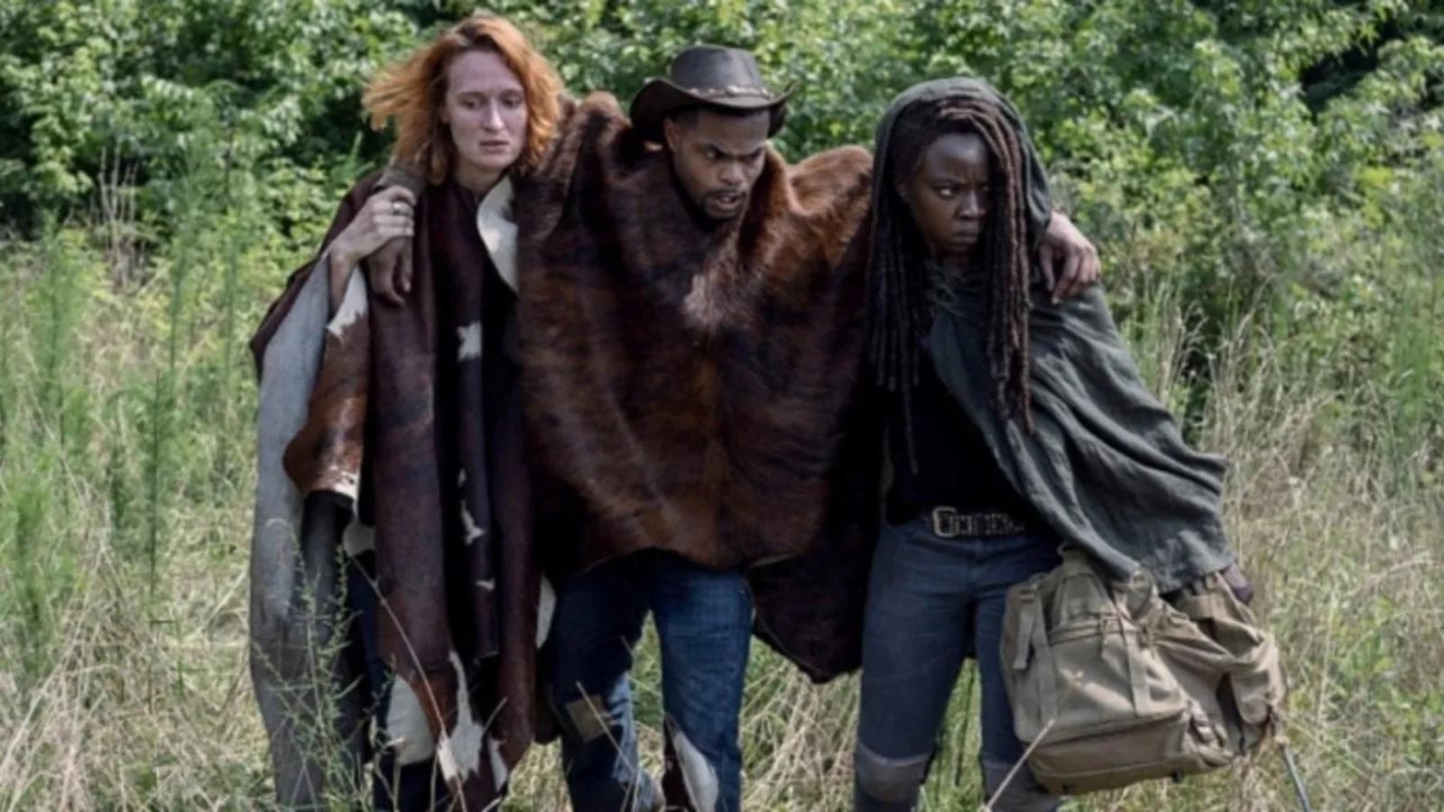 King Bach as Bailey in The Walking Dead, being carried by Michonne and Aiden