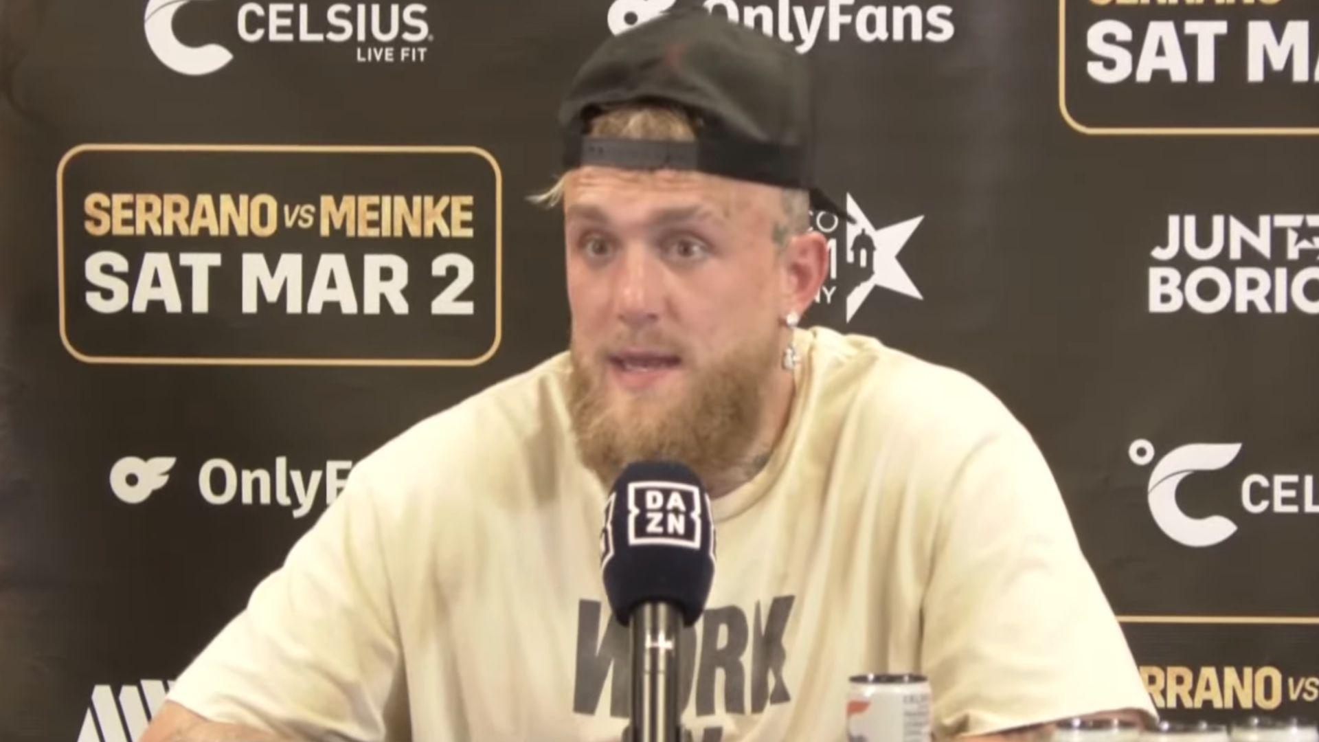 Jake Paul talking into mic in press conference