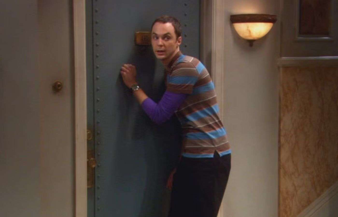 Sheldon Cooper knocking on a door in The Big Bang Theory.