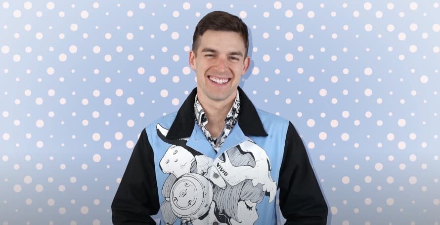 A photo of YouTube star MatPat smiling against a blue background.